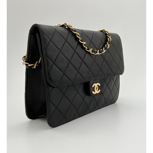 Chanel mid flap black leather vintage ref. 7665