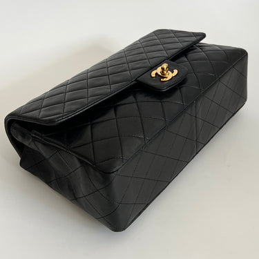 Chanel  black leather with gold metal 