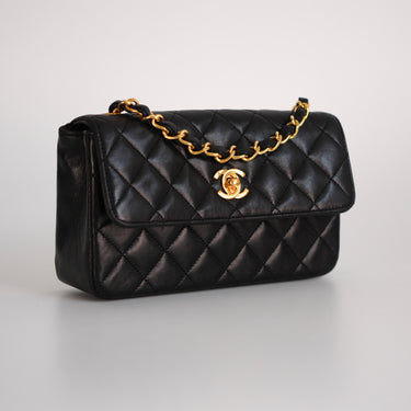 Chanel black leather mini vintage ref. 7946